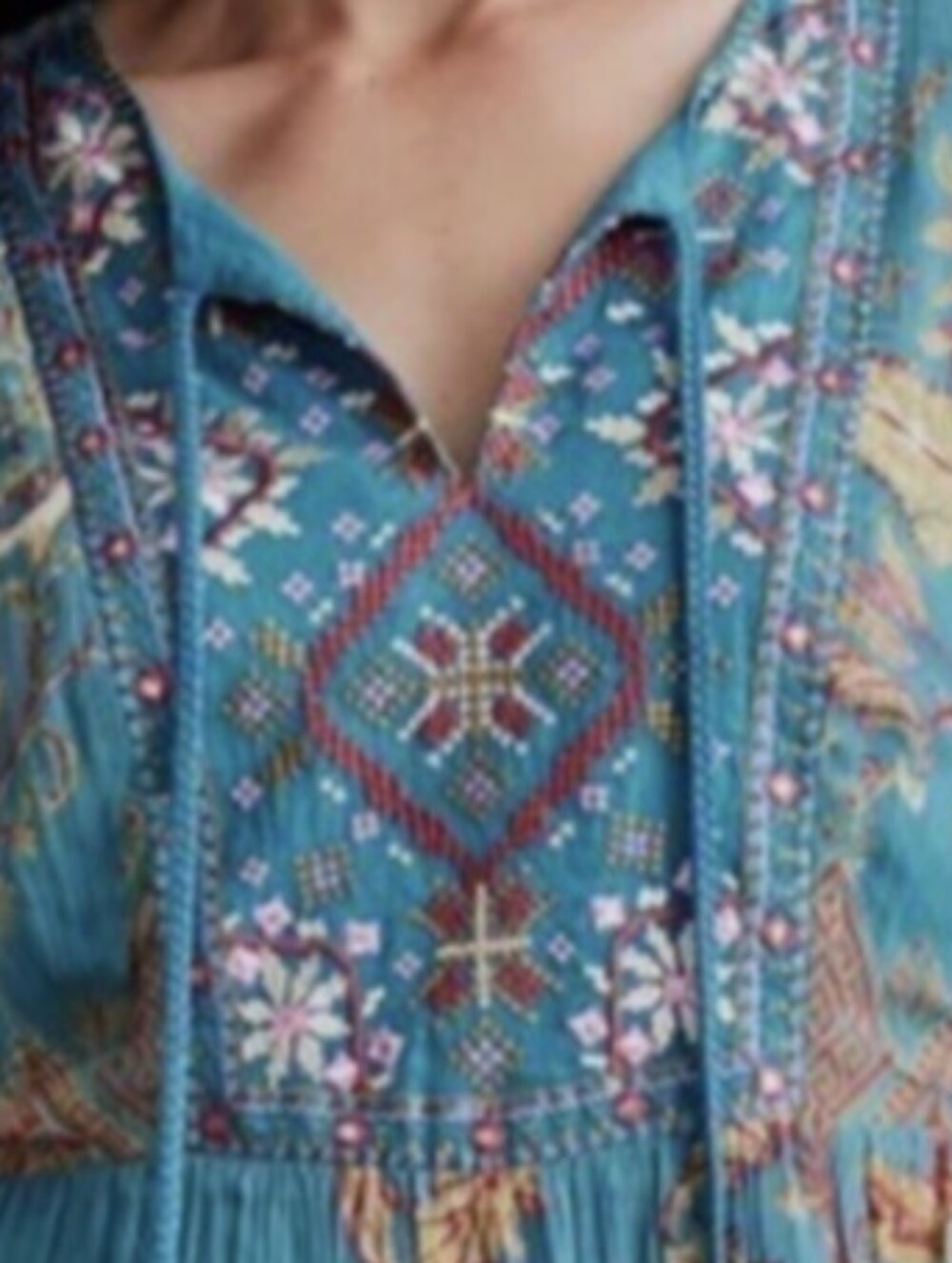 Teal Background, with a colorful yet subtle embroidery.  Rayon Cotton